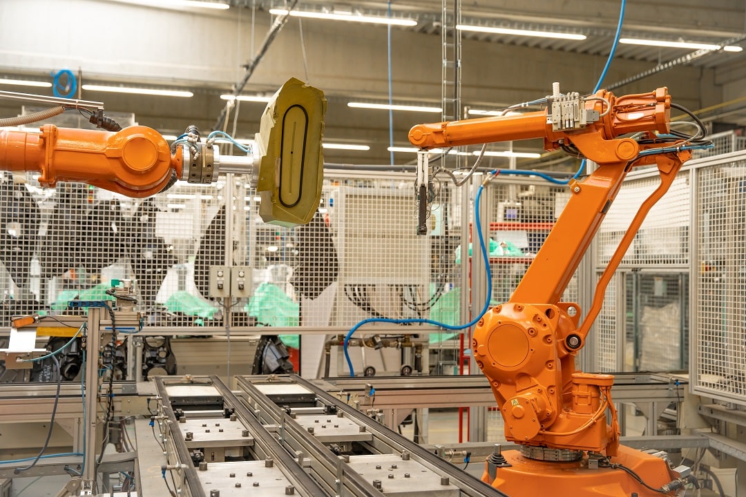 robot arms in the factory performs precise work according to the specified program